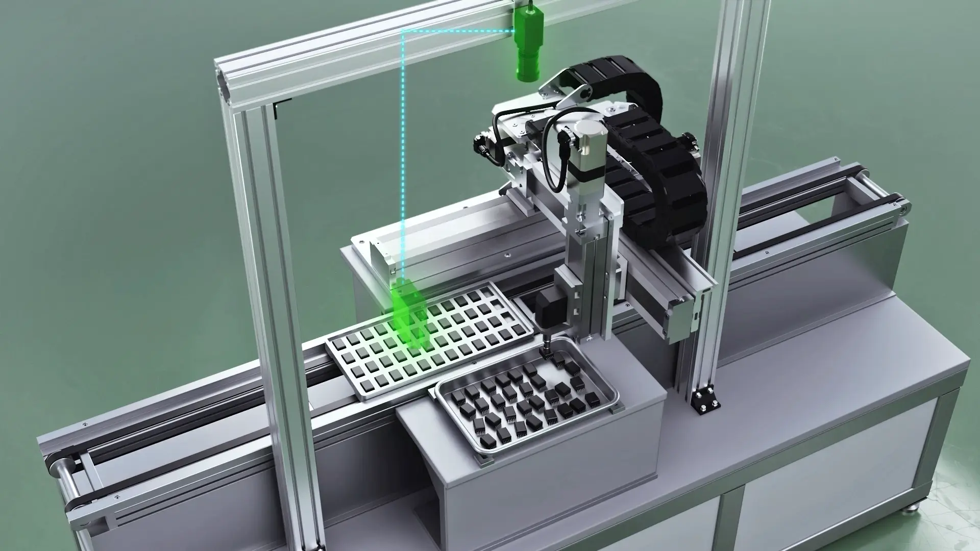 An automated device in which an aluminum frame gantry robot performs precision picking work from black and white parts trays using a green laser guide